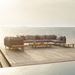 Luxury teak outdoor bench with cushions from Dedon’s Sealine collection – Casa Design Group