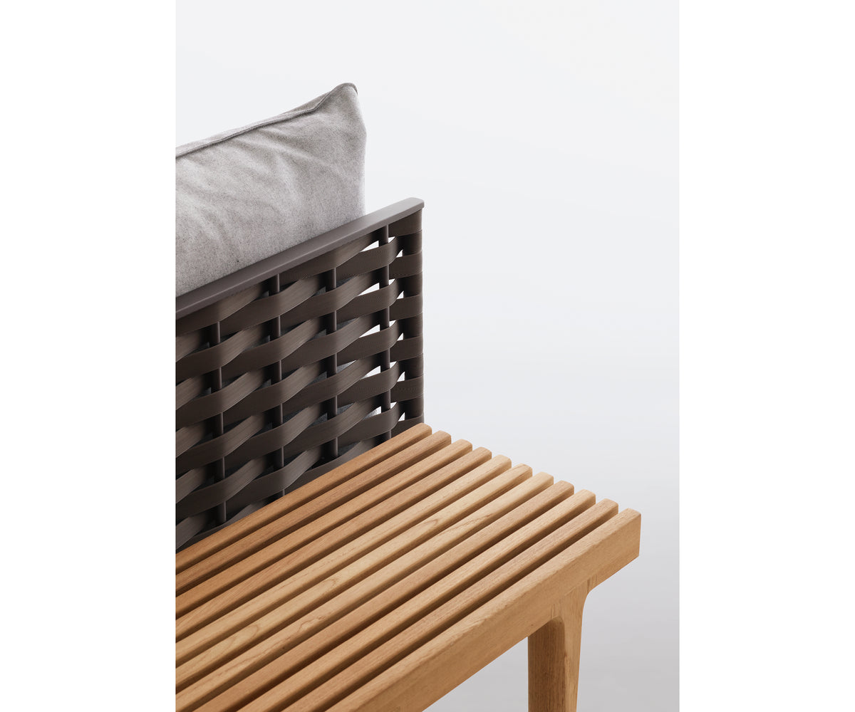 Luxury teak outdoor bench with cushions from Dedon’s Sealine collection – Casa Design Group