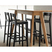 Sit Bar Chair by Zeitraum featuring minimalist solid wood construction, upholstered seat options, and ergonomic footrest | Casa Design Group