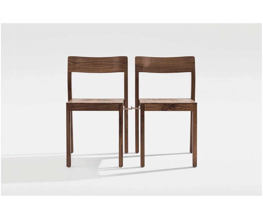 Sit Dining Chair by Zeitraum featuring solid wood construction, stackable functionality, and timeless contemporary design | Casa Design Group