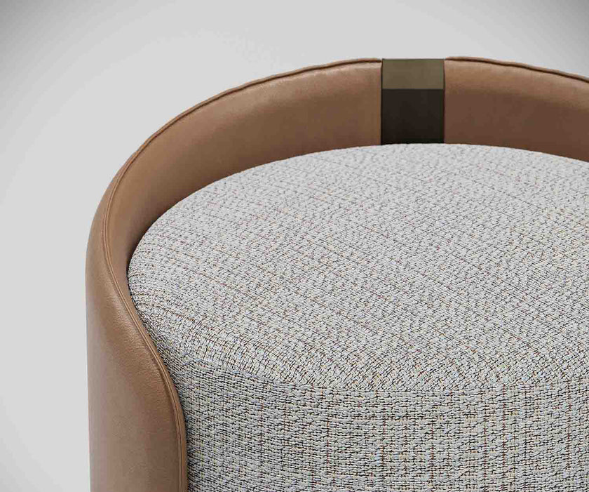 Suite elegant upholstered pouf by Capital with curved shell design and deep cushioned seat | Casa Design Group