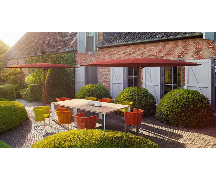 Elegant Sunset Outdoor Dining Table by Paola Lenti Casa Design Group