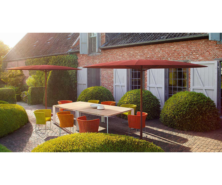 Elegant Sunset Outdoor Dining Table by Paola Lenti Casa Design Group