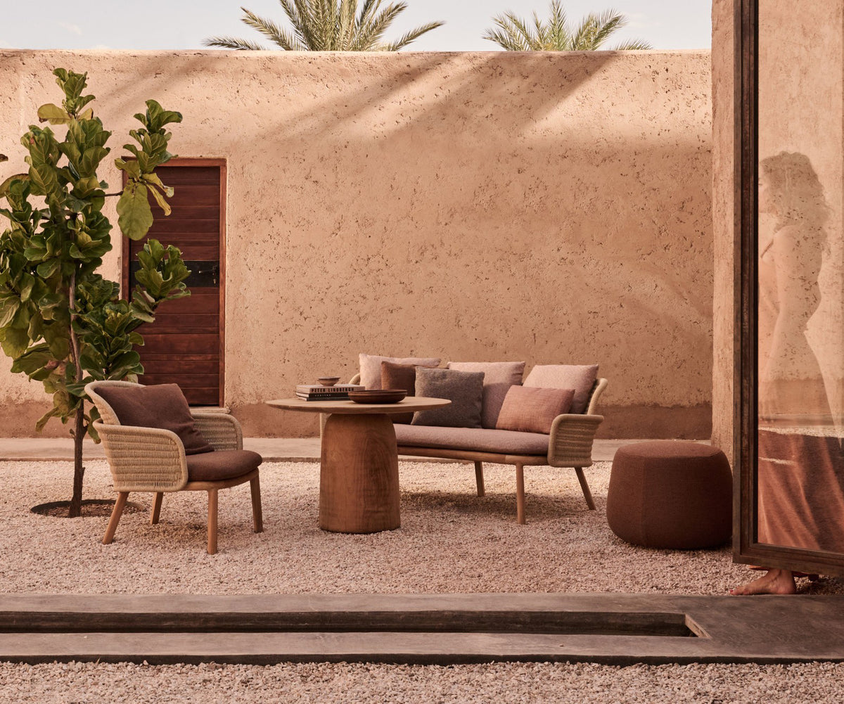 Elegant Suro Outdoor Sofa by Tribù with teak wood and braided rope | Casa Design Group