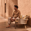 Elegant Suro Outdoor Sofa by Tribù with teak wood and braided rope | Casa Design Group