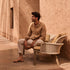 Elegant Suro Outdoor Sofa by Tribù with teak wood and braided rope | Casa Design Group