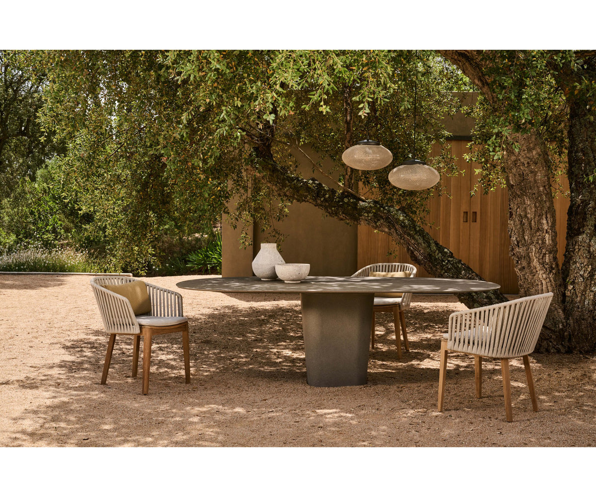 Tao Oval Outdoor Dining Table by Tribù with sculptural pedestals and refined concrete top | Casa Design Group