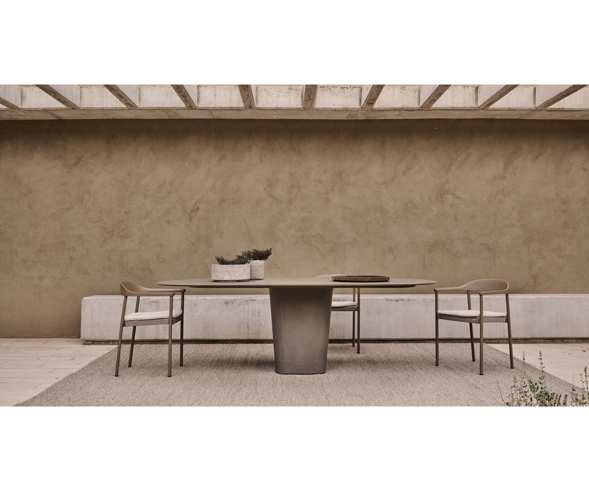 Tao Oval Outdoor Dining Table by Tribù with sculptural pedestals and refined concrete top | Casa Design Group