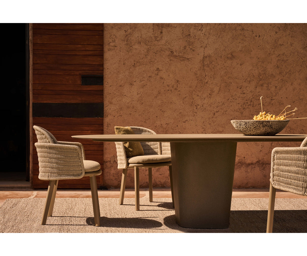 Tao Round Outdoor Dining Table by Tribù with sculptural pedestals and refined concrete top | Casa Design Group.