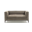 Taylor Medium Sofa by Frigerio featuring a contemporary modular design with clean lines, upholstered seating, and a sleek metal base.