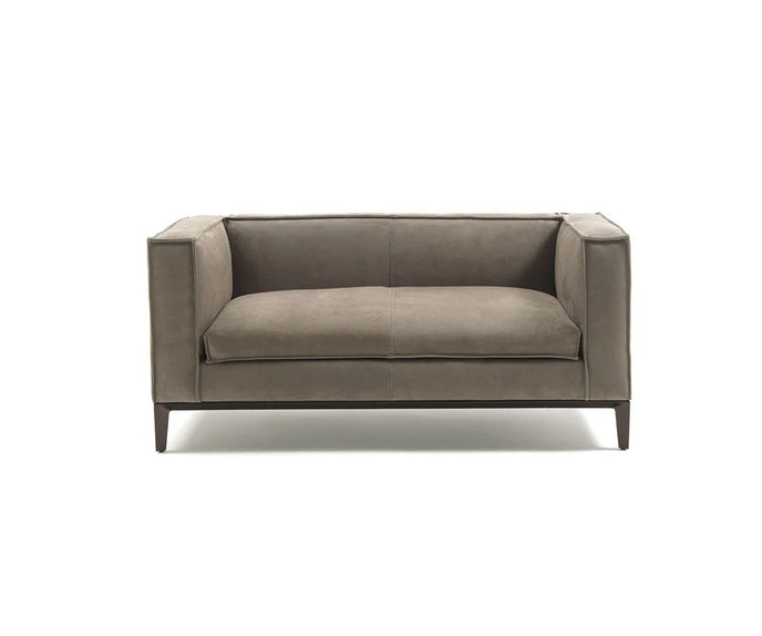 Taylor Medium Sofa by Frigerio featuring a contemporary modular design with clean lines, upholstered seating, and a sleek metal base.