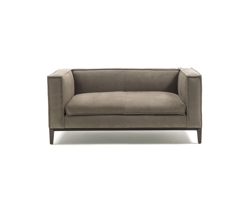 Taylor Medium Sofa by Frigerio featuring a contemporary modular design with clean lines, upholstered seating, and a sleek metal base.