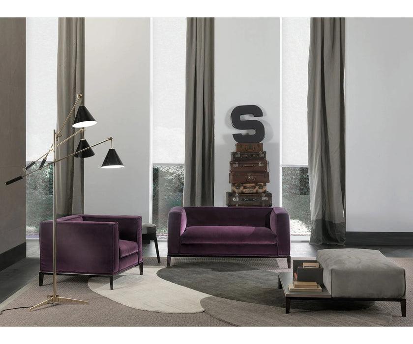 Taylor Medium Sofa by Frigerio featuring a contemporary modular design with clean lines, upholstered seating, and a sleek metal base.