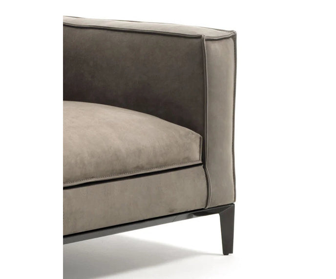 Taylor Medium Sofa by Frigerio featuring a contemporary modular design with clean lines, upholstered seating, and a sleek metal base.
