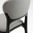 Teresa Bar Stool with curved upholstered backrest, solid wood frame and satin steel footrest by Ceccotti Collezioni | Casa Design Group