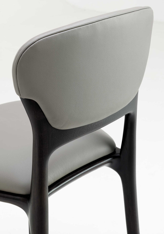Teresa Bar Stool with curved upholstered backrest, solid wood frame and satin steel footrest by Ceccotti Collezioni | Casa Design Group
