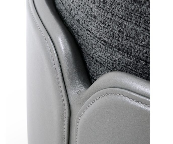 Teti elegant upholstered pouf by Giorgetti with lacquered or leather-wrapped base | Casa Design Group
