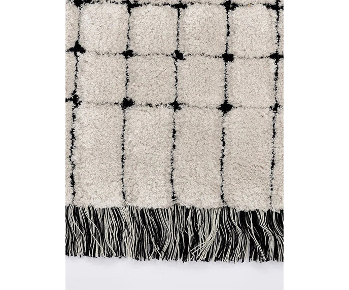 Frigerio Theo Rug with hand-tufted texture and refined geometric detailing for luxury interiors Casa Design Group