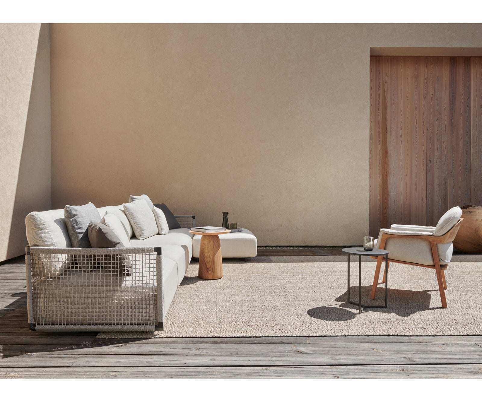 Contemporary Nodi Outdoor Sofa by Tribù with stainless steel frame and plush cushions | Casa Design Group