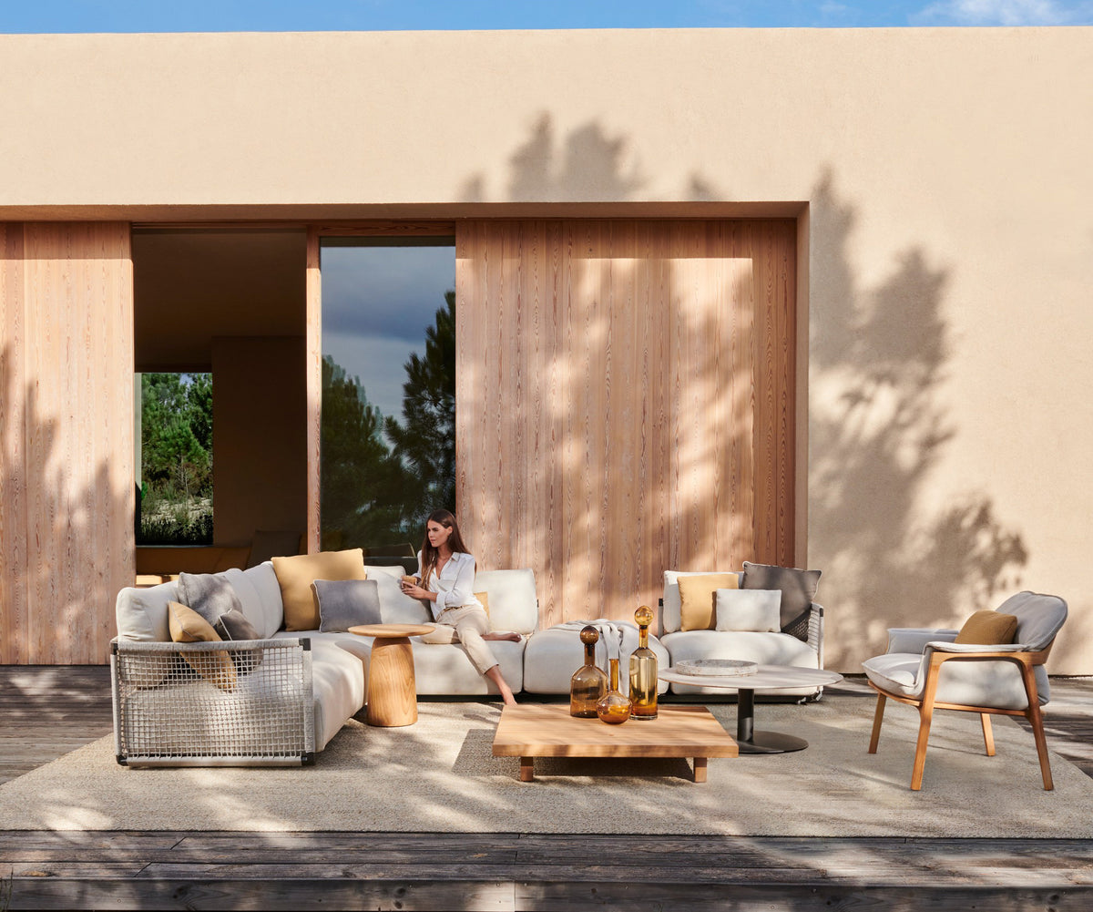 Contemporary Nodi Outdoor Sofa by Tribù with stainless steel frame and plush cushions | Casa Design Group