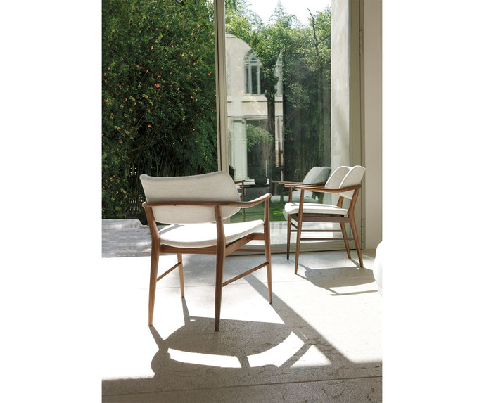 Porada Nissa dining armchair with a solid Canaletta walnut frame and fabric or leather upholstery | Casa Design Group