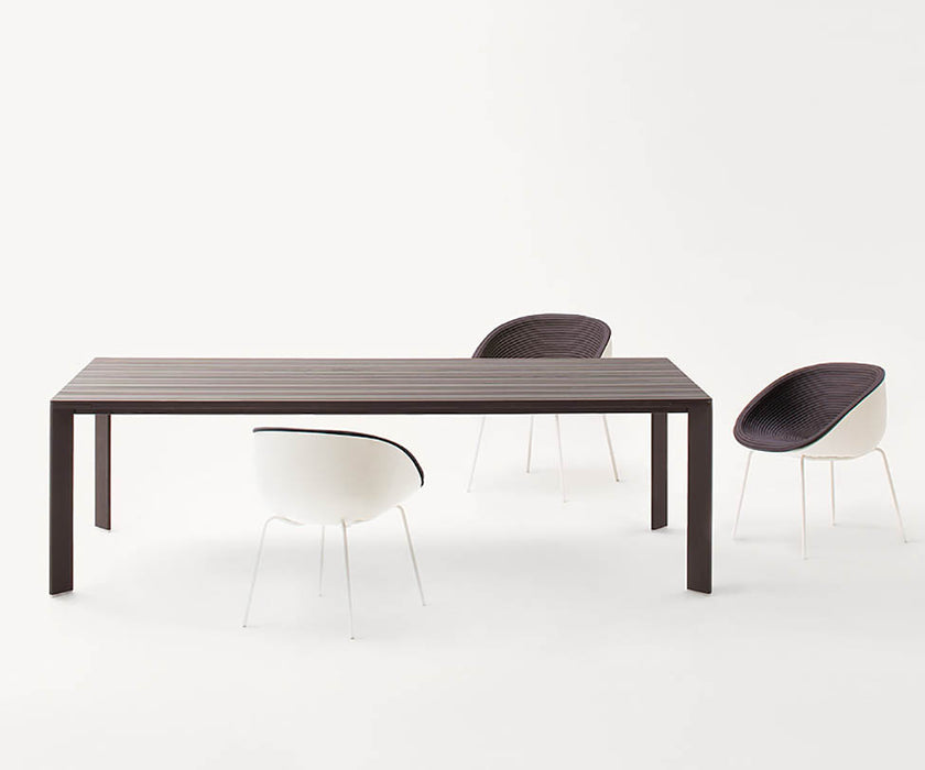 Elegant Sunset Outdoor Dining Table by Paola Lenti Casa Design Group
