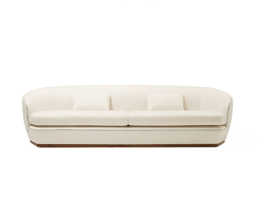 Tamino Sofa by Giorgetti with Canaletto walnut structure and refined contemporary design | Casa Design Group